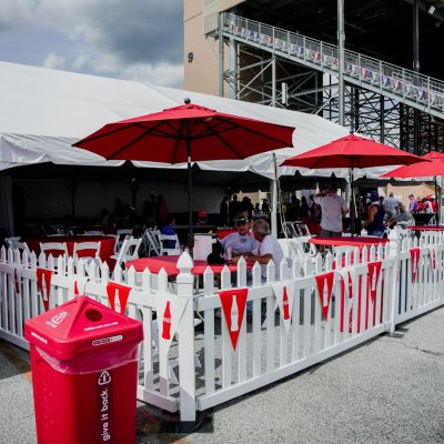 Fiesta Tent, White Picket Fence, White Resin Padded Chair, Red Poly Linen, Red Umbrella