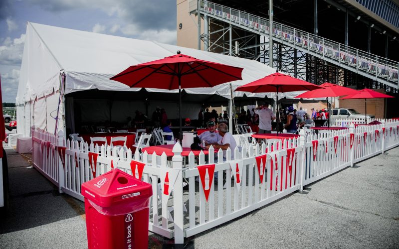Fiesta Tent, White Picket Fence, White Resin Padded Chair, Red Poly Linen, Red Umbrella
