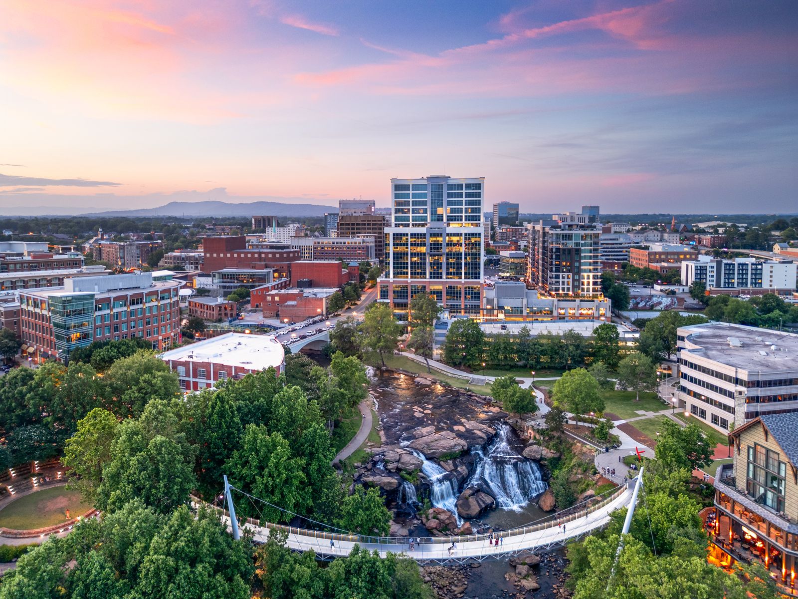 Aerial view of downtown Greenville, SC and Falls Park on the Reedy at dusk